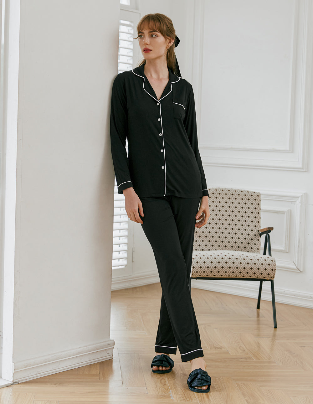 Women's long sleeve pajama set in black with a turn-down collar