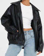 Oversized faux leather bomber jacket — styled on model, full length