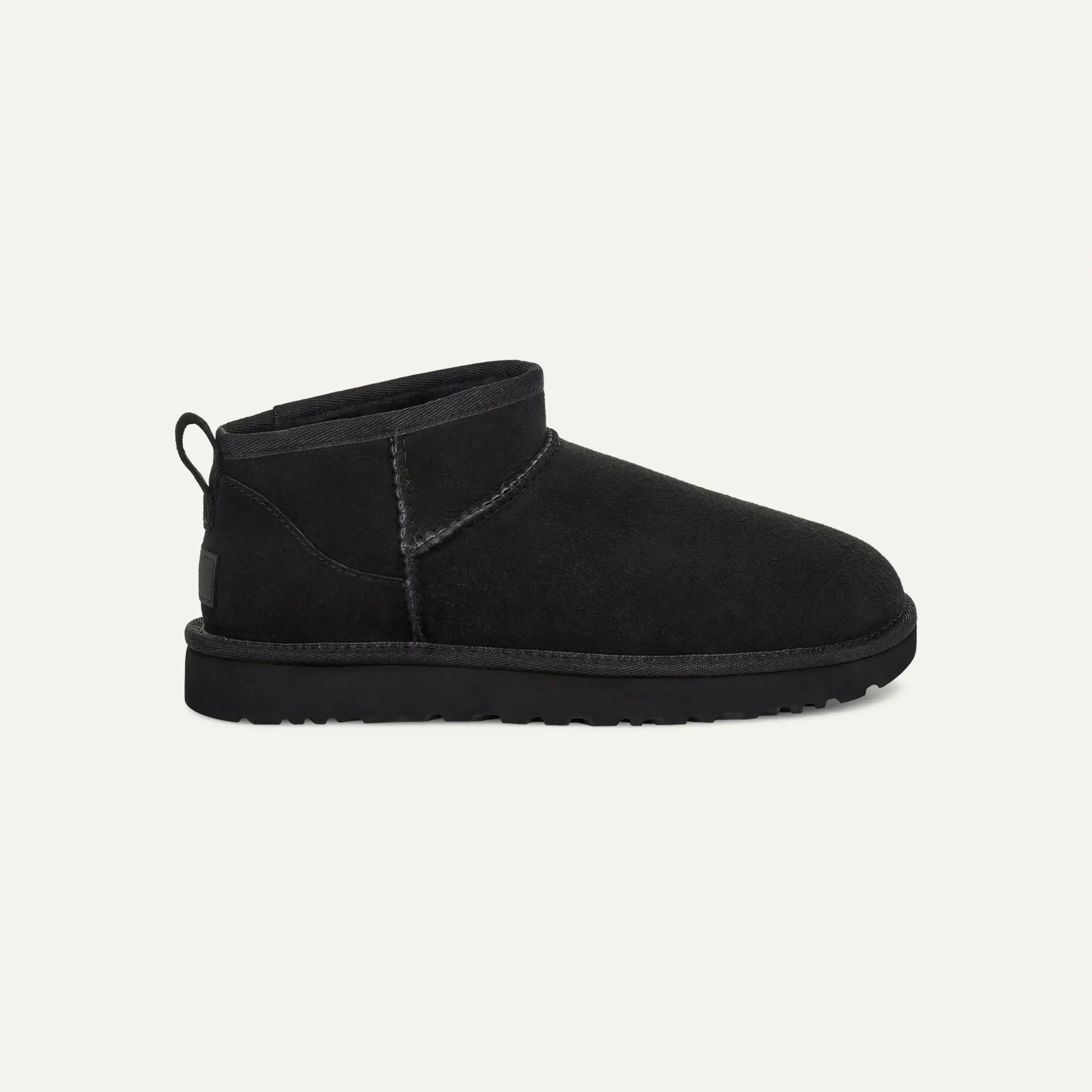 Mini ankle boots for women in black, side view