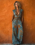 Boho floral jumpsuit for women, styled resort view showing the side pockets