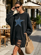 Drop shoulder seam and sleeve detail of the sweatshirt dress