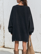 Ripped and distressed hem detail of the sweatshirt dress