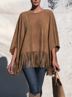 Brown faux suede fringe poncho, front view on model