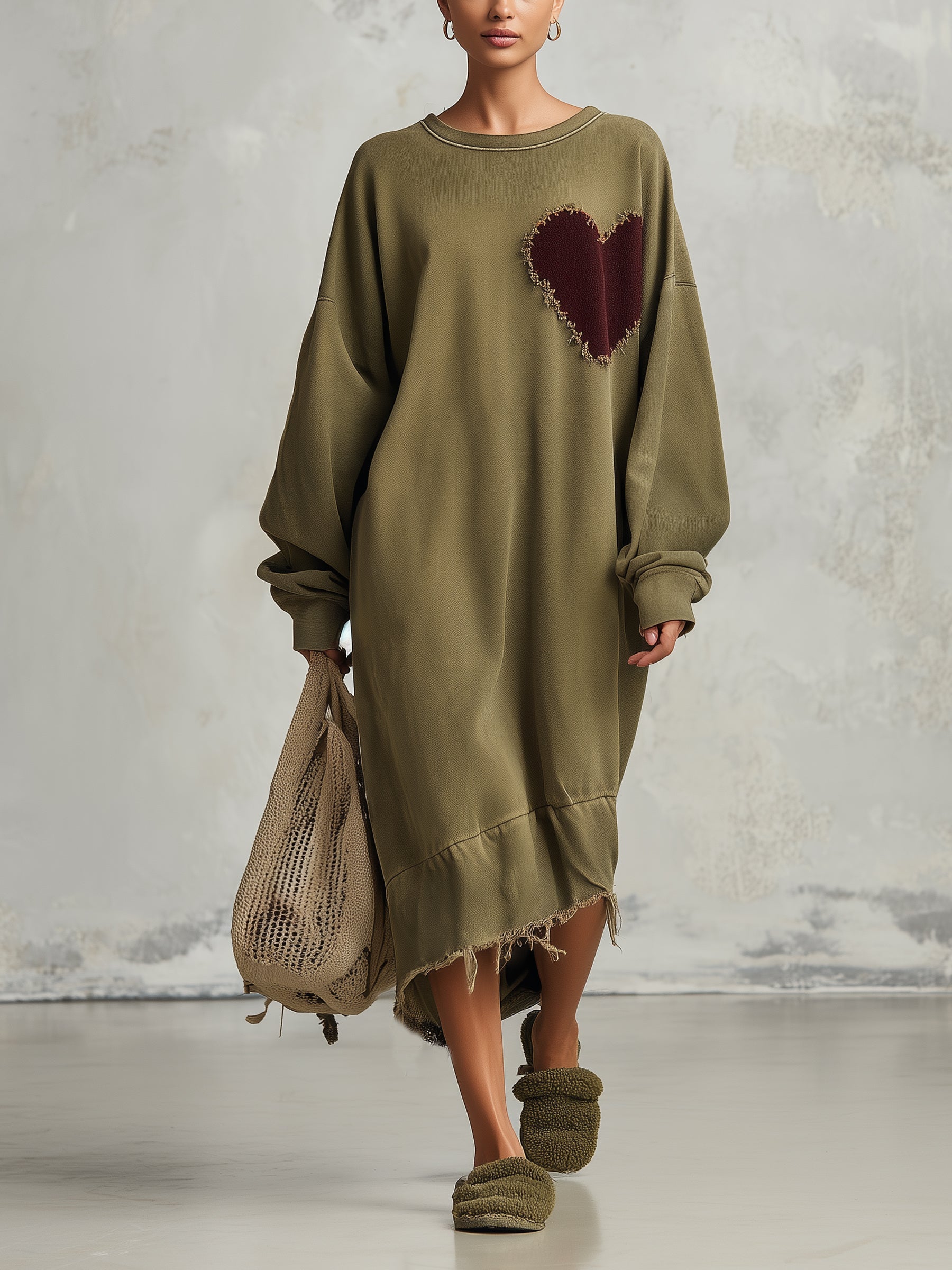 Olive sweatshirt dress with a heart patch at the chest, front view