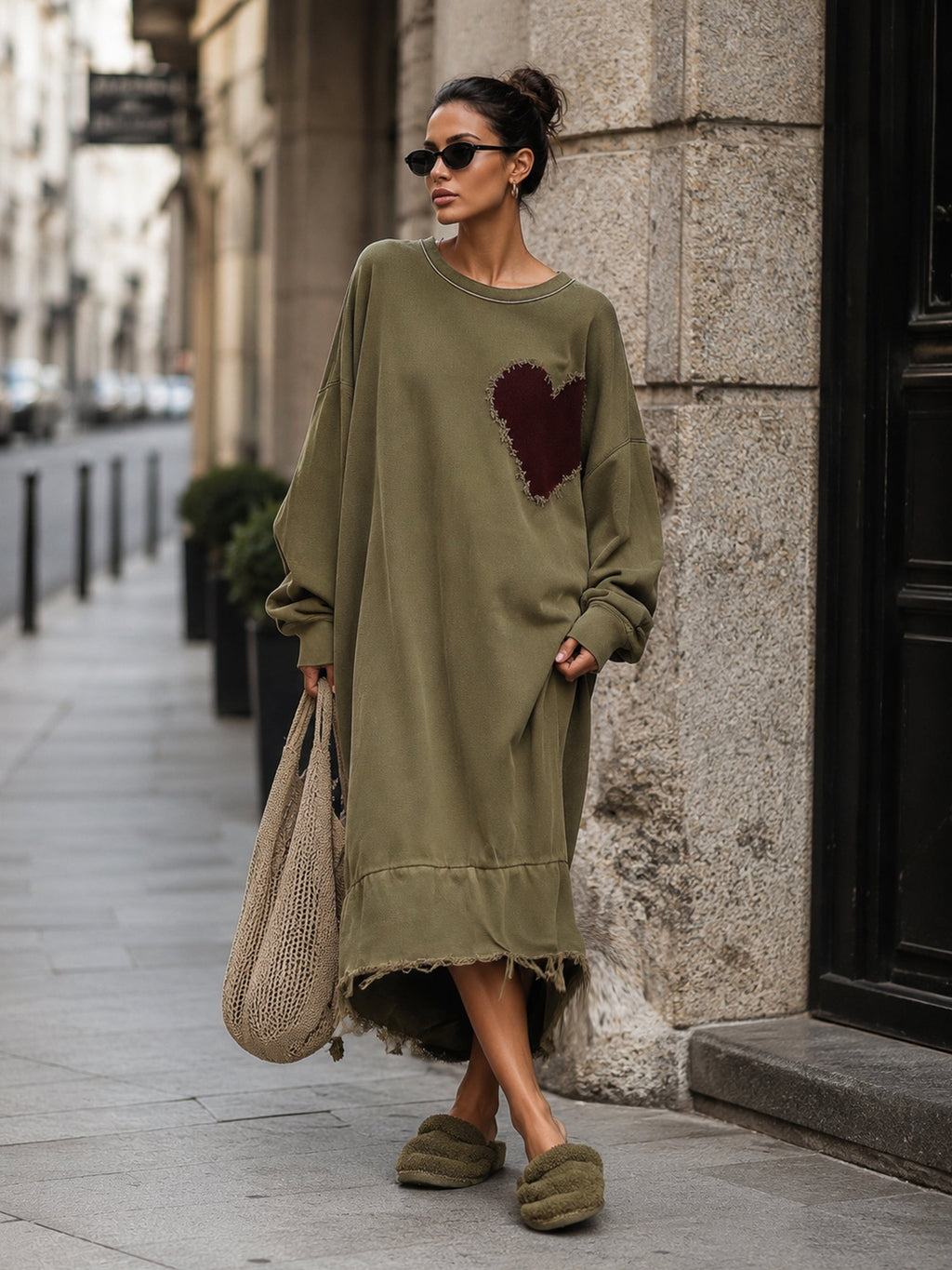 Model wearing the olive midi sweatshirt dress with dropped shoulders
