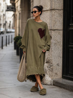 Model wearing the olive midi sweatshirt dress with dropped shoulders