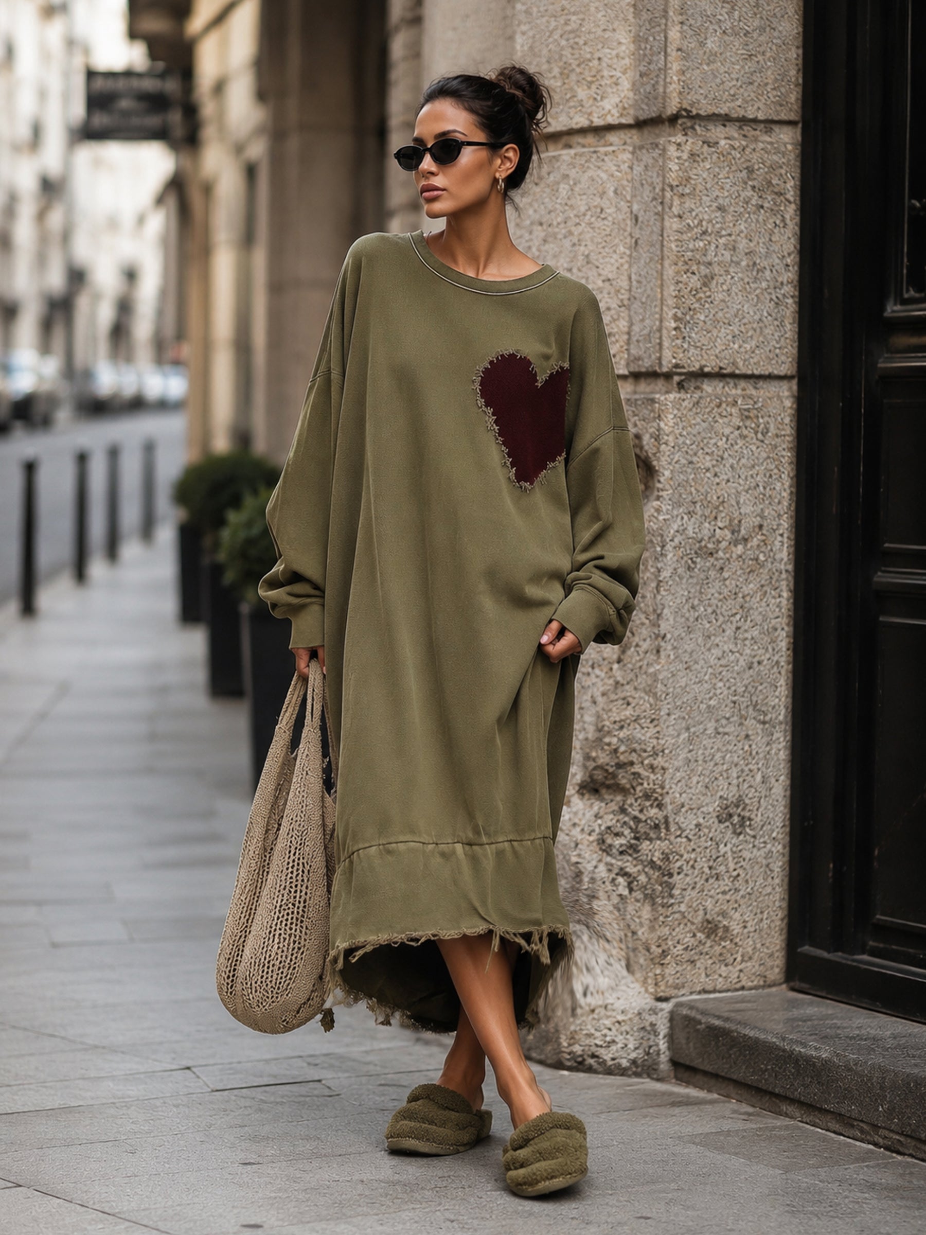 Model wearing the olive midi sweatshirt dress with dropped shoulders