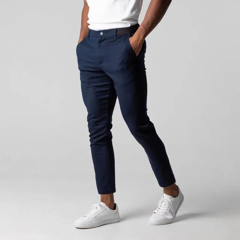 Men's stretch chinos in navy, worn with a shirt