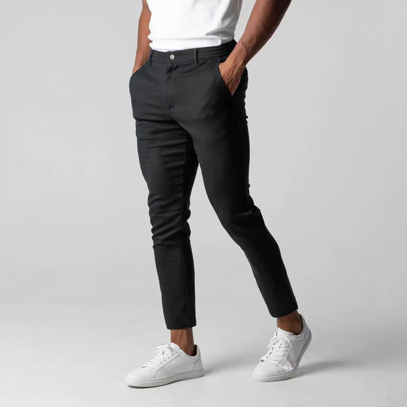 Men's stretch chinos in black, full-length front view