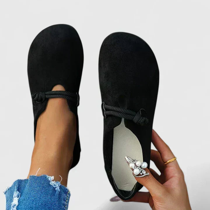 Black ergonomic loafers shown from the front