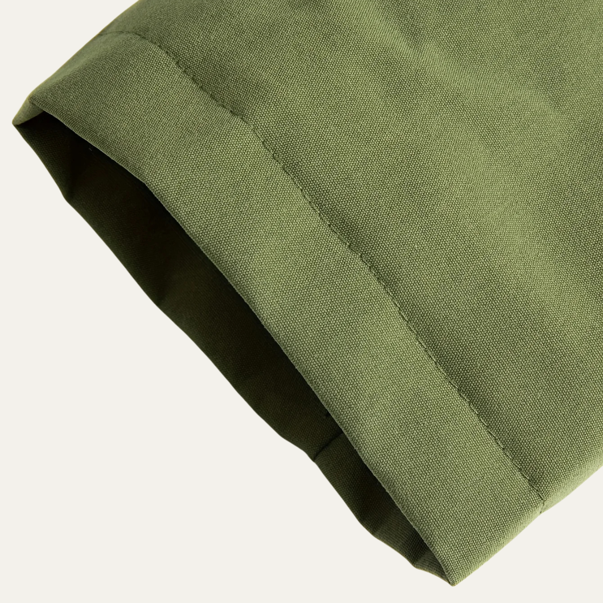 Hooded waterproof raincoat — worn open over a jumper