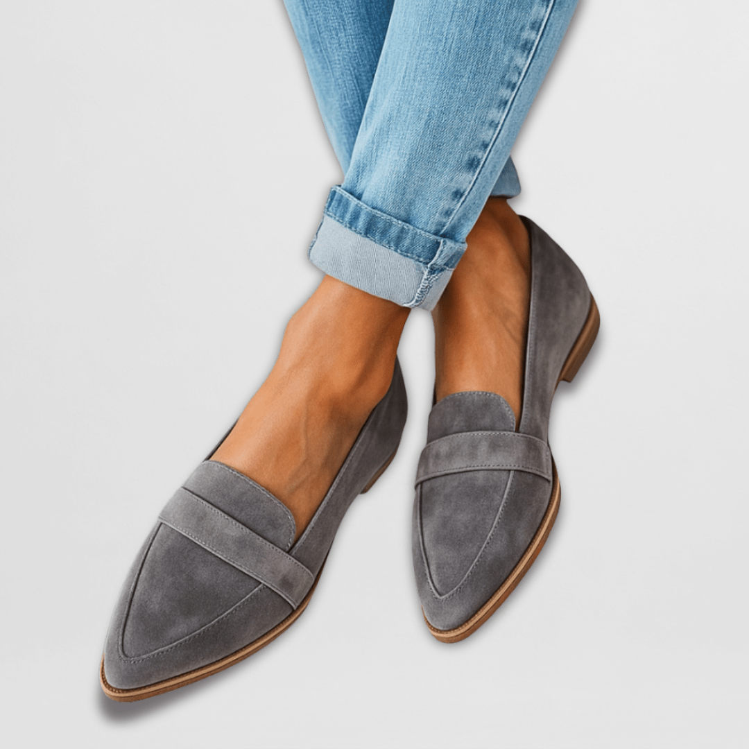 Gray cushioned loafers shown from a three quarter angle