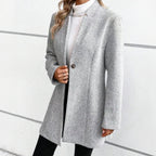 Gray jacquard longline coat, angled view showing the shoulder line and sleeve