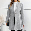 Gray jacquard longline coat, photographed flat against a plain backdrop