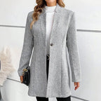 Gray jacquard longline coat, photographed flat against a plain backdrop