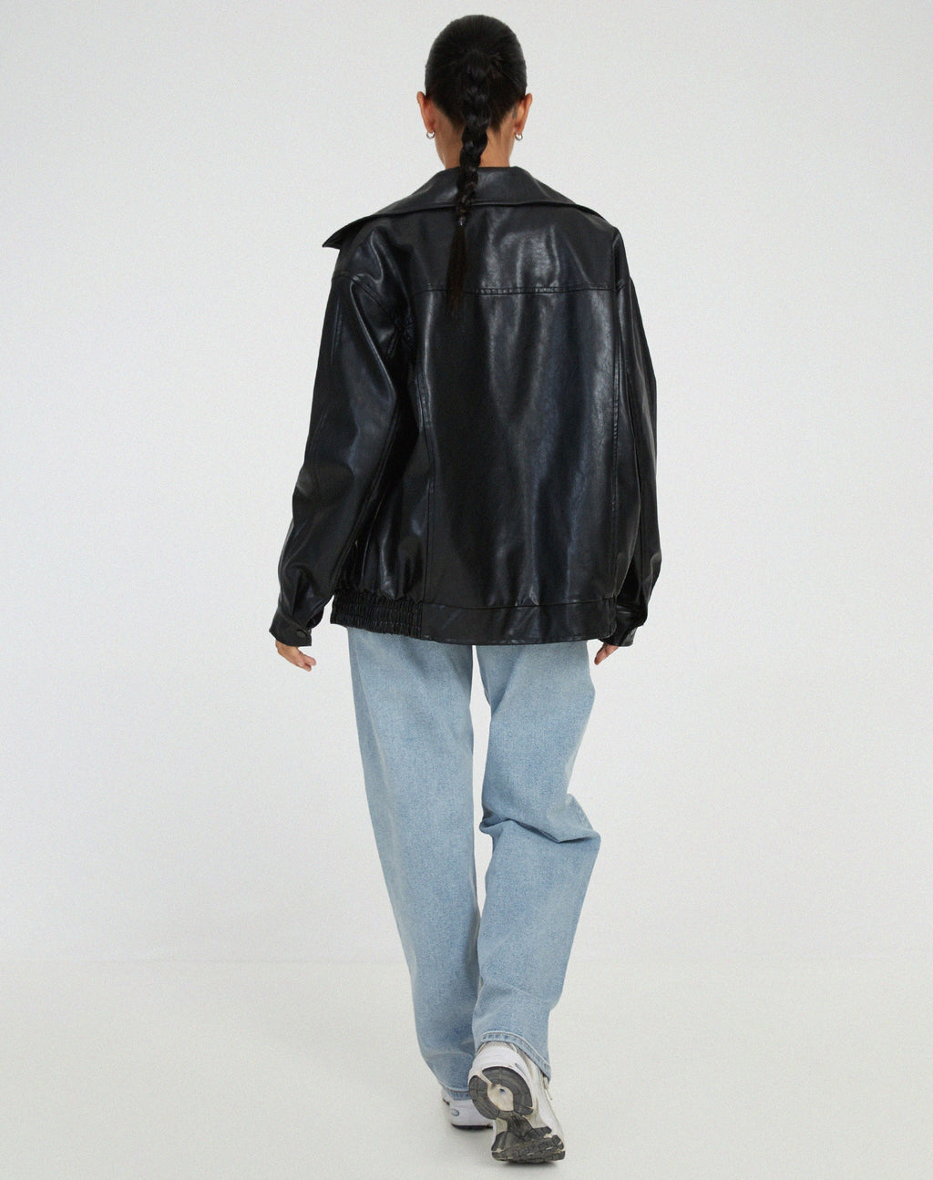 Oversized faux leather bomber jacket — close-up of the trim and finish