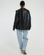 Oversized faux leather bomber jacket — close-up of the trim and finish