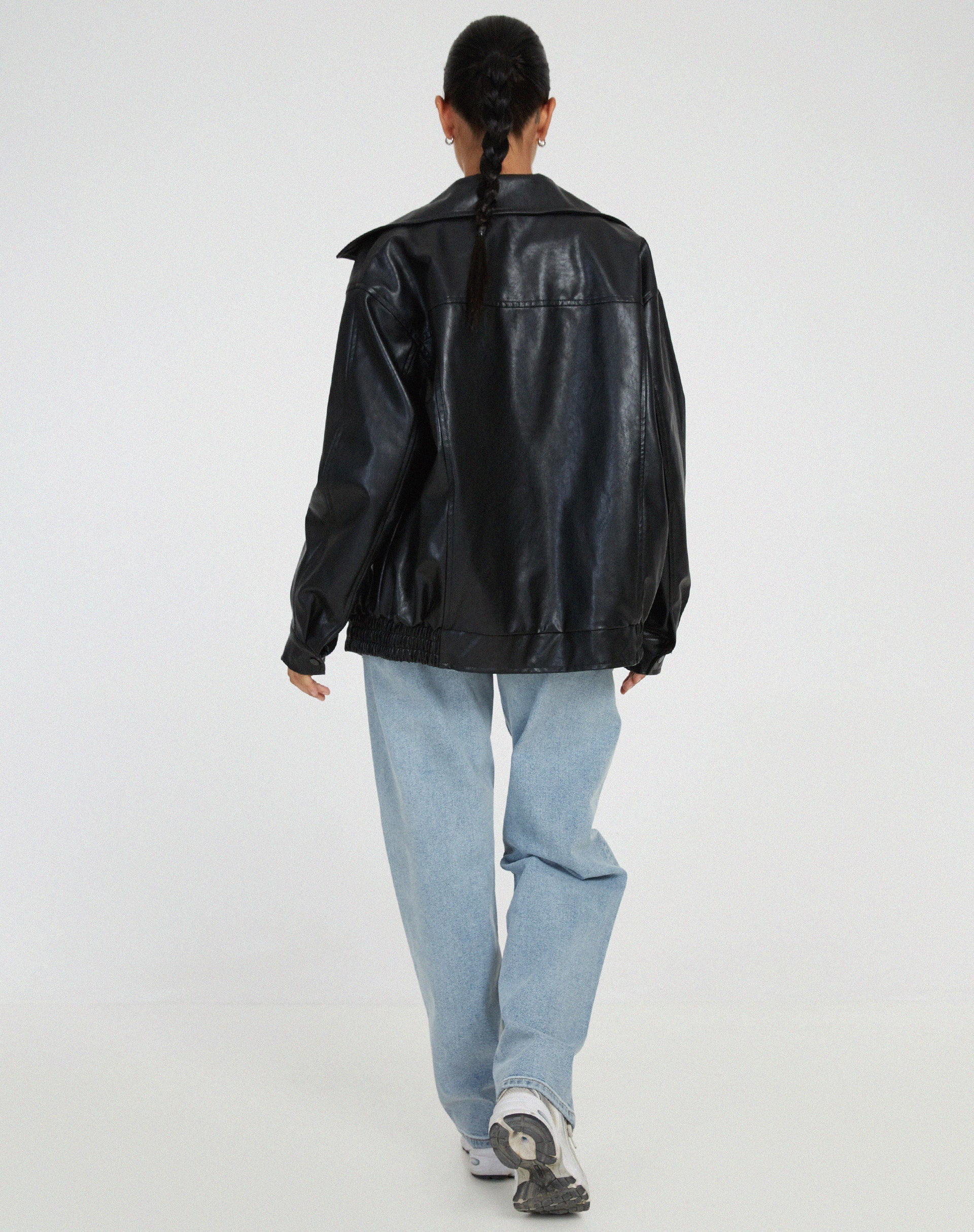Oversized faux leather bomber jacket — close-up of the trim and finish