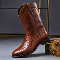 Cognac brown leather boot in profile, stitching visible along the welt