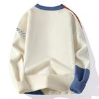 Men's patchwork sweater, close view of the colour block panels and ribbed trim