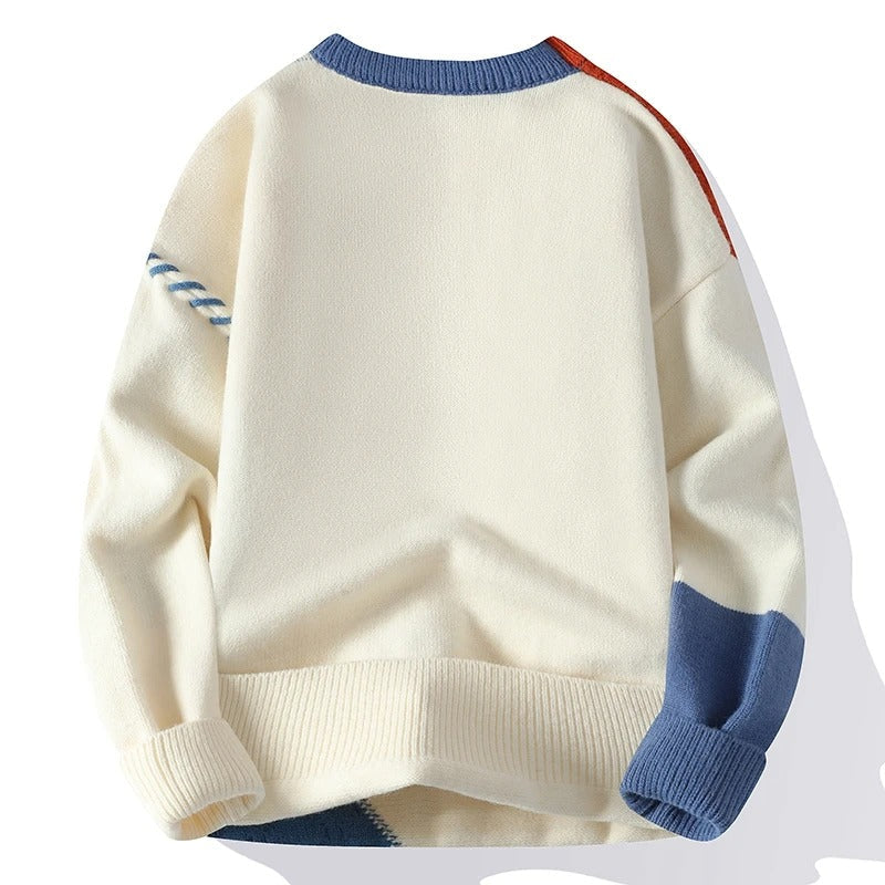 Men's patchwork sweater, close view of the colour block panels and ribbed trim