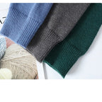 Men's patchwork sweater, side view showing the relaxed fit