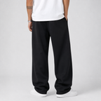 Men's thick knit joggers worn with a tee, side view showing the drape
