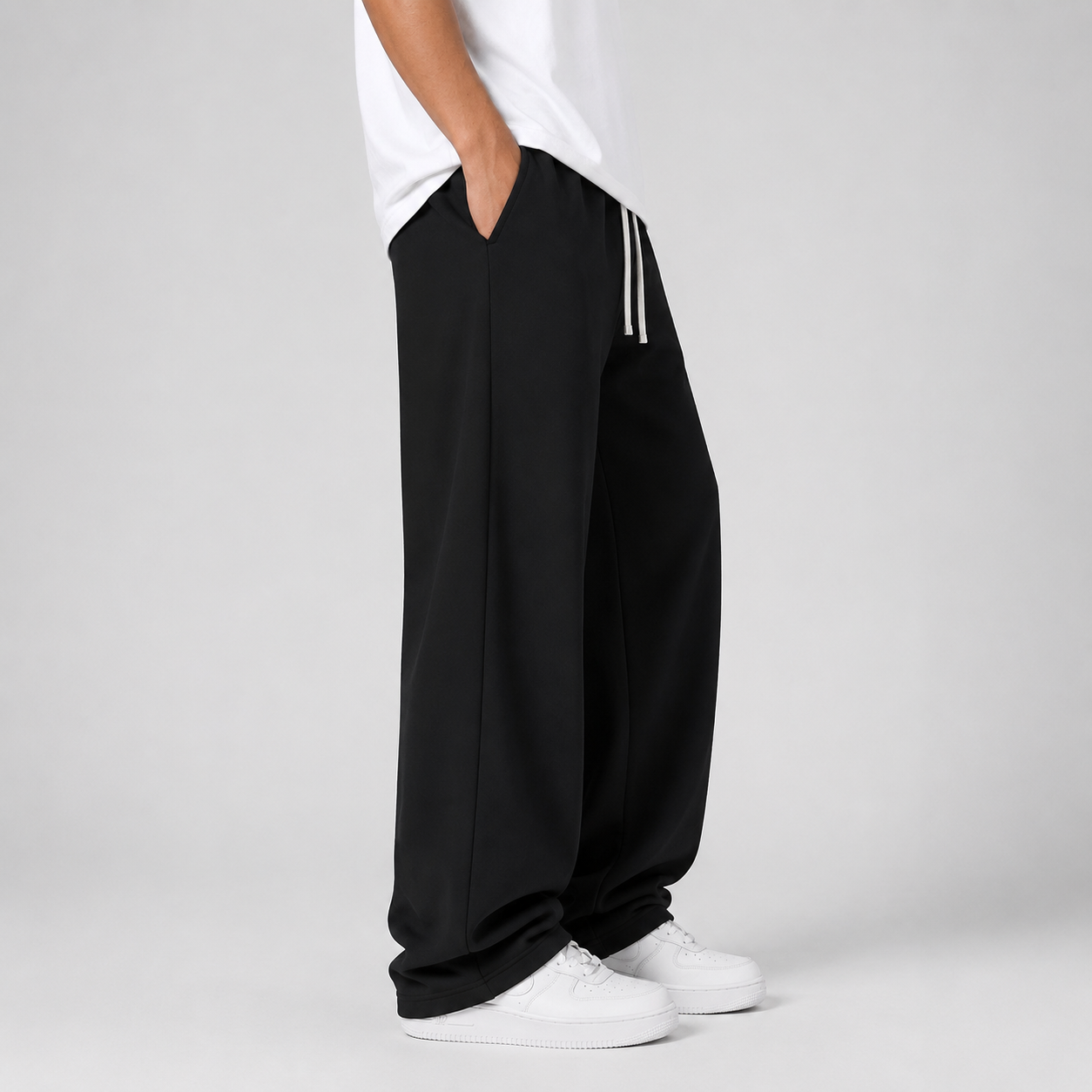 Close-up of the elastic drawstring waistband and knit texture on the men's joggers