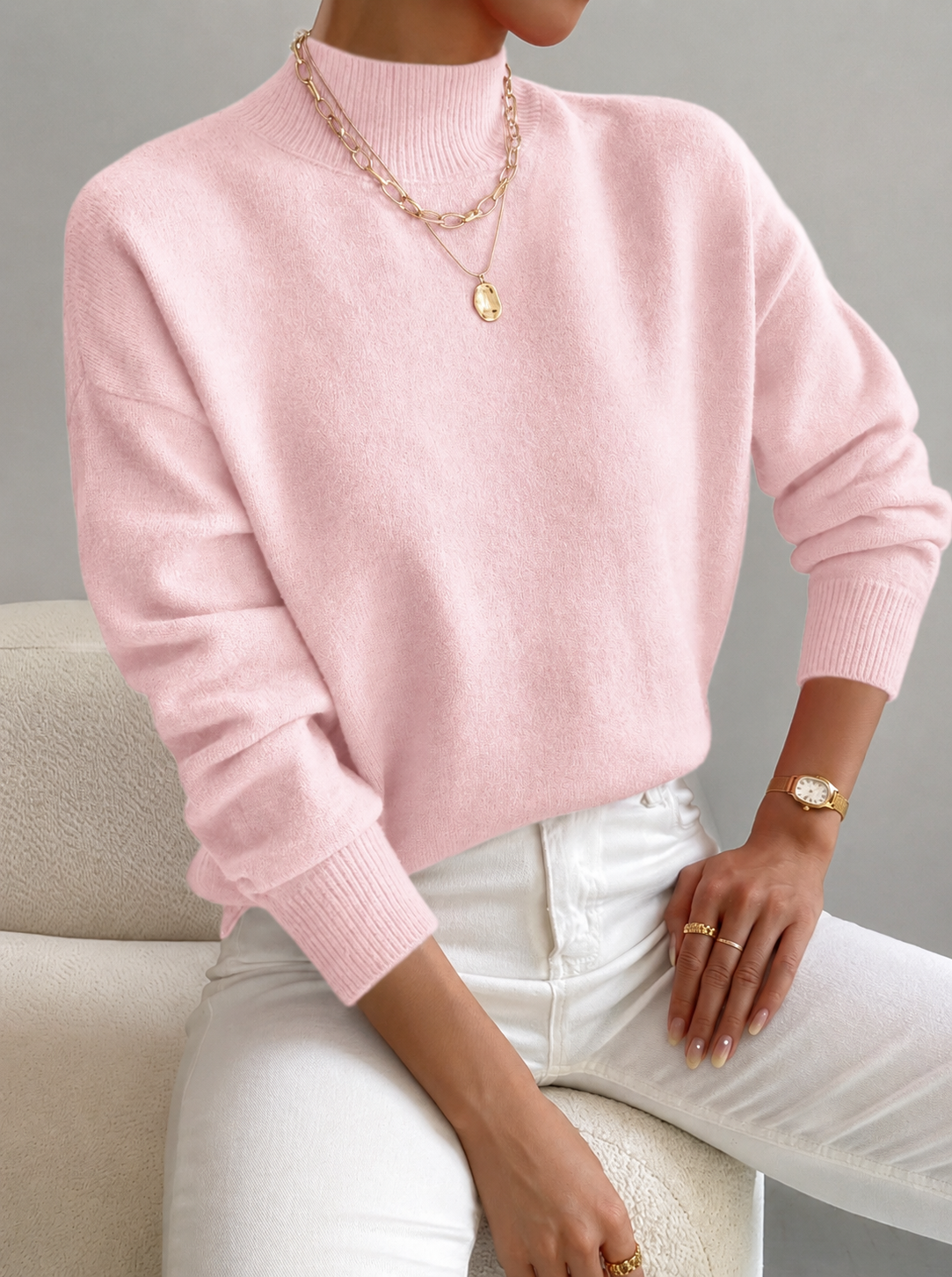Turtleneck sweater for women in light pink, worn as a layering top