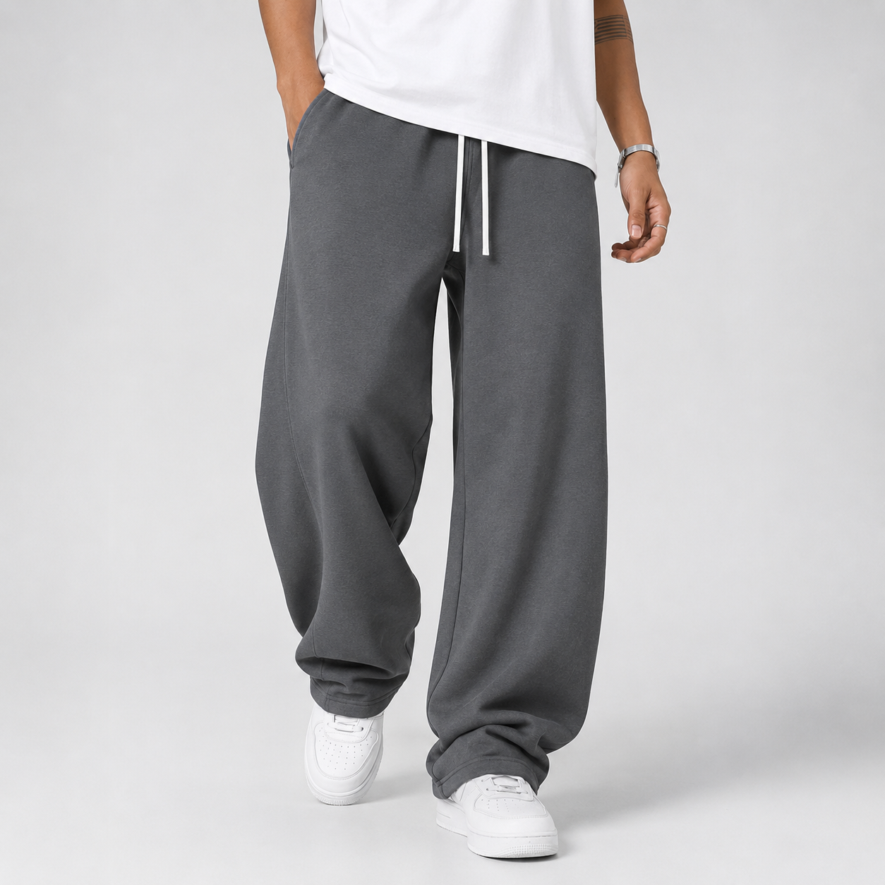 Men's joggers in dark grey, front view of the loose straight leg