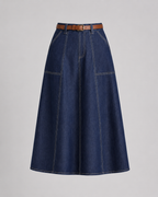 Close-up of the mid-rise waistband and invisible zip on the navy pleated skirt