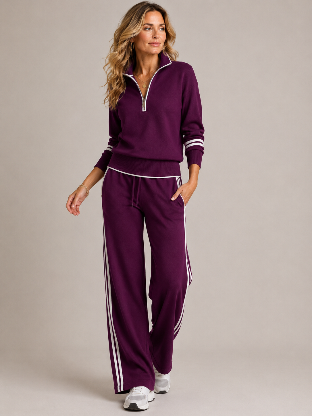 Purple knit matching set shown on a model, full length