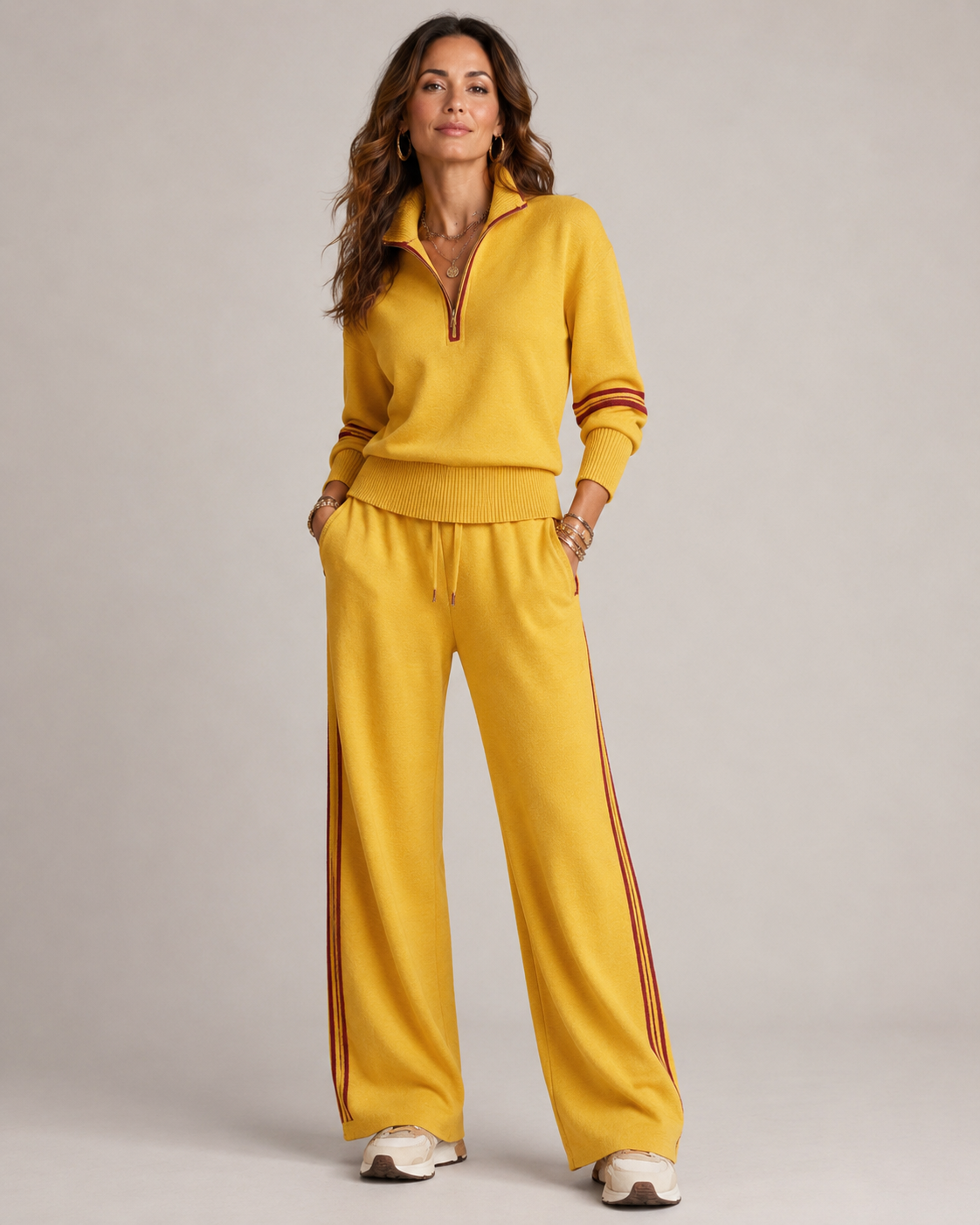 Yellow quarter zip top and trousers photographed together