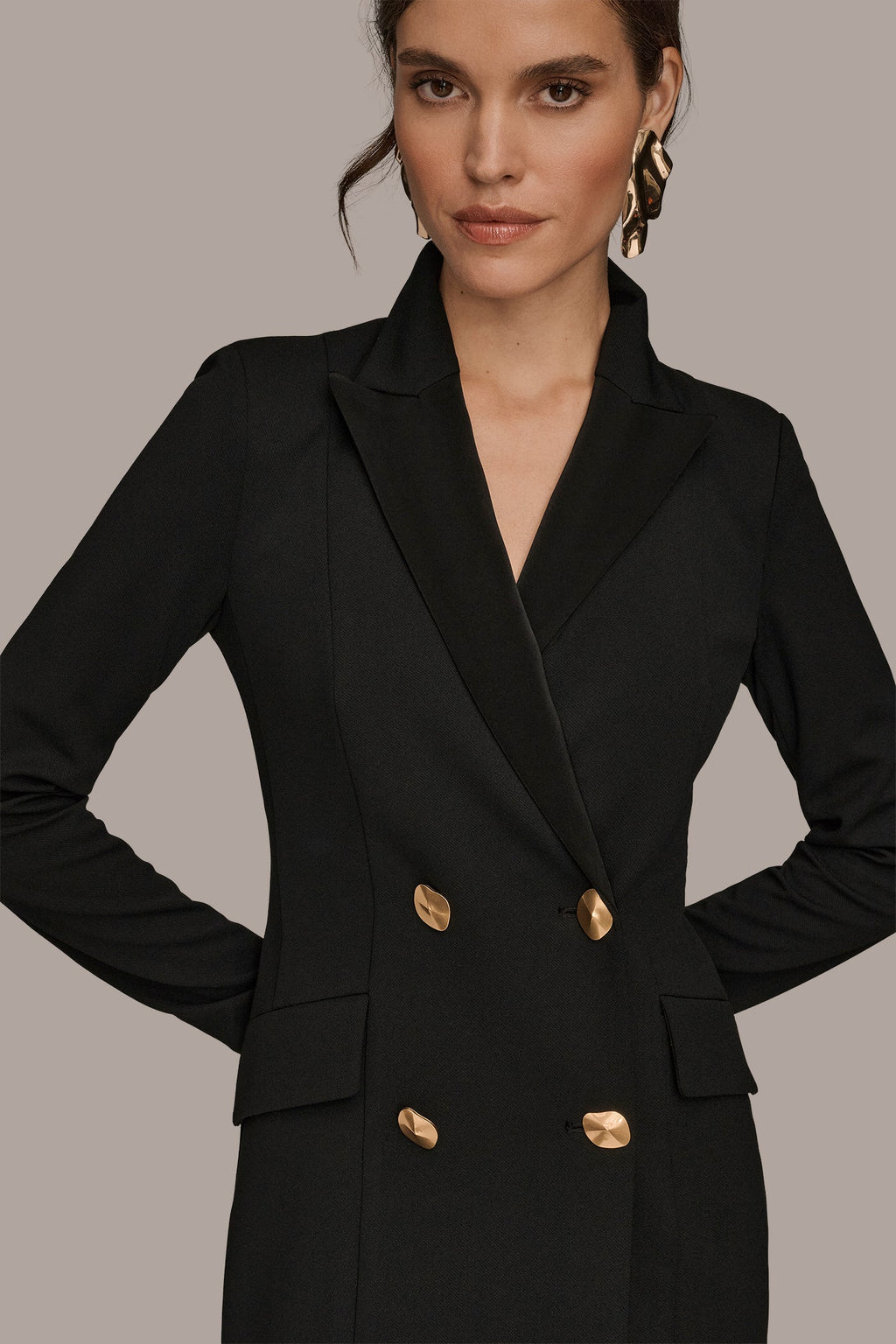 Black double-breasted maxi dress, close-up of the satin against matte crepe