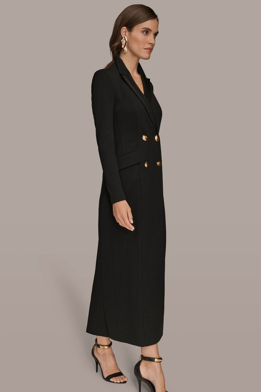 Black double-breasted maxi dress, side view showing the hip flap pockets