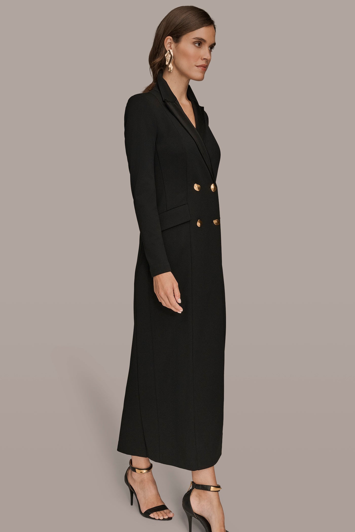 Black double-breasted maxi dress, side view showing the hip flap pockets
