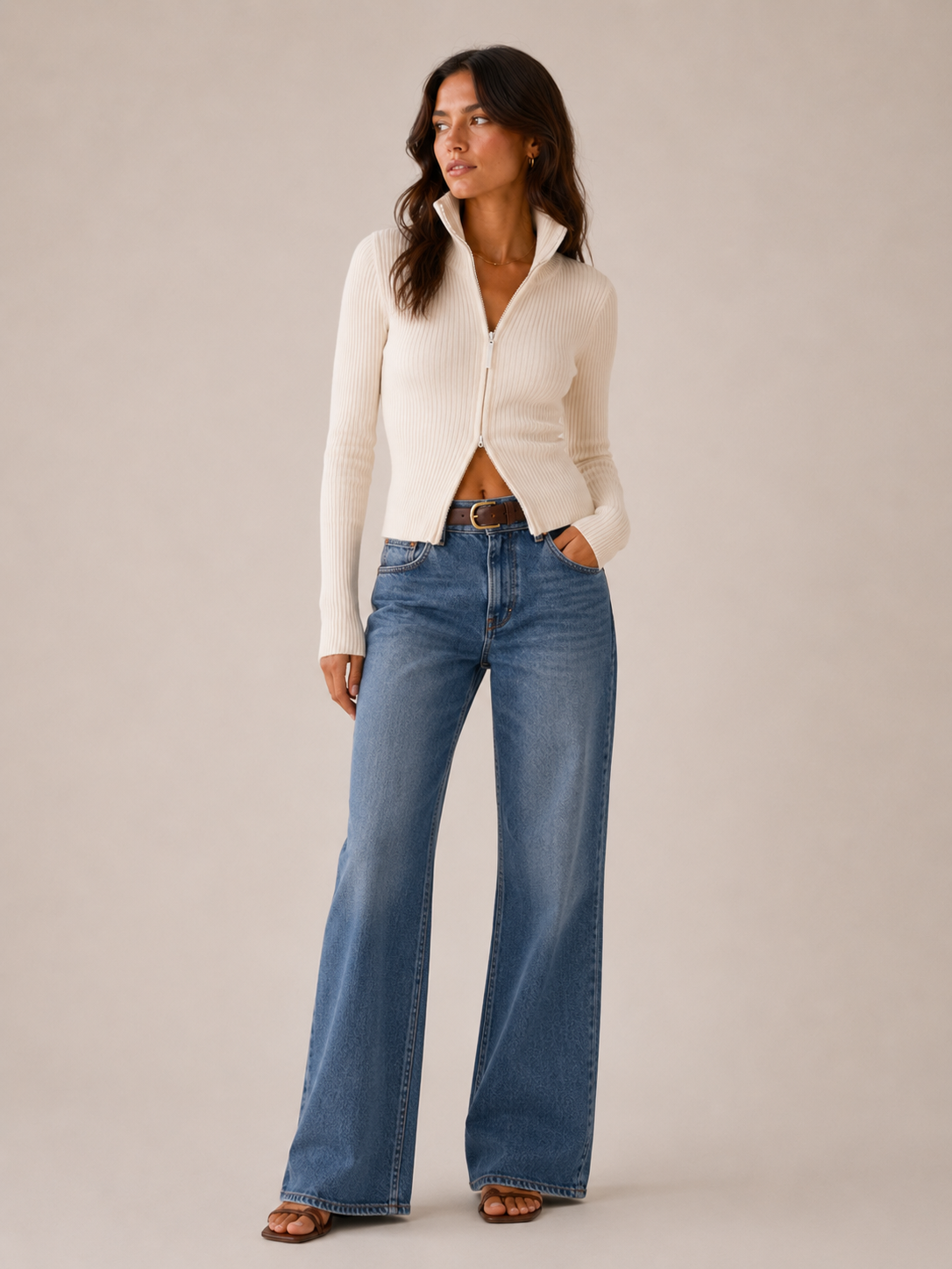 The cardigan worn with the high collar zipped to the throat