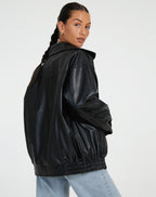 Oversized faux leather bomber jacket — flat lay showing the full shape