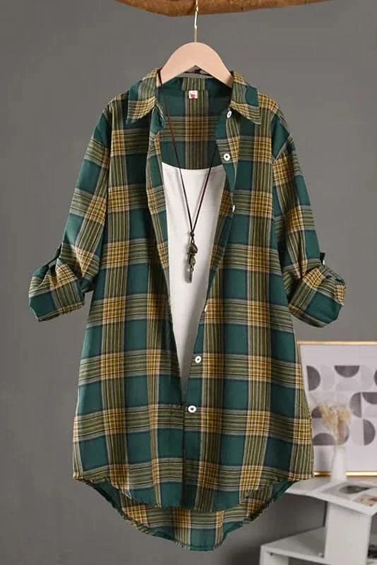 Green plaid flannel shirt shown buttoned on a model