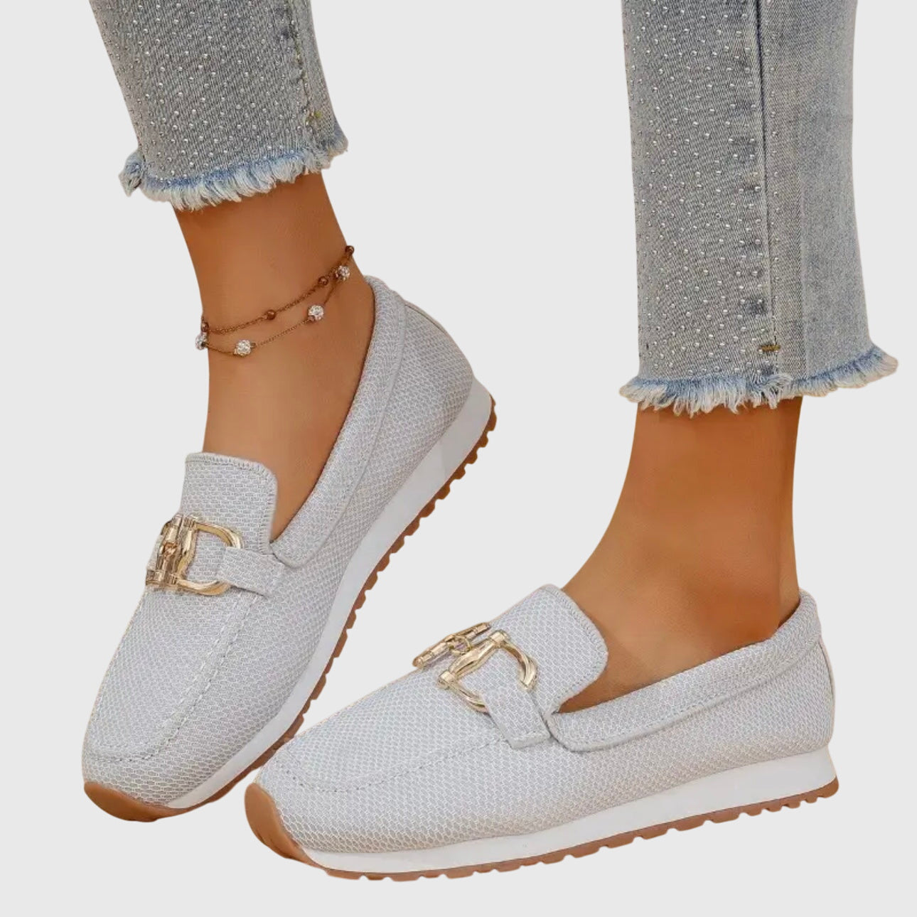 Women's slip-on loafer in White, shown against a plain studio background