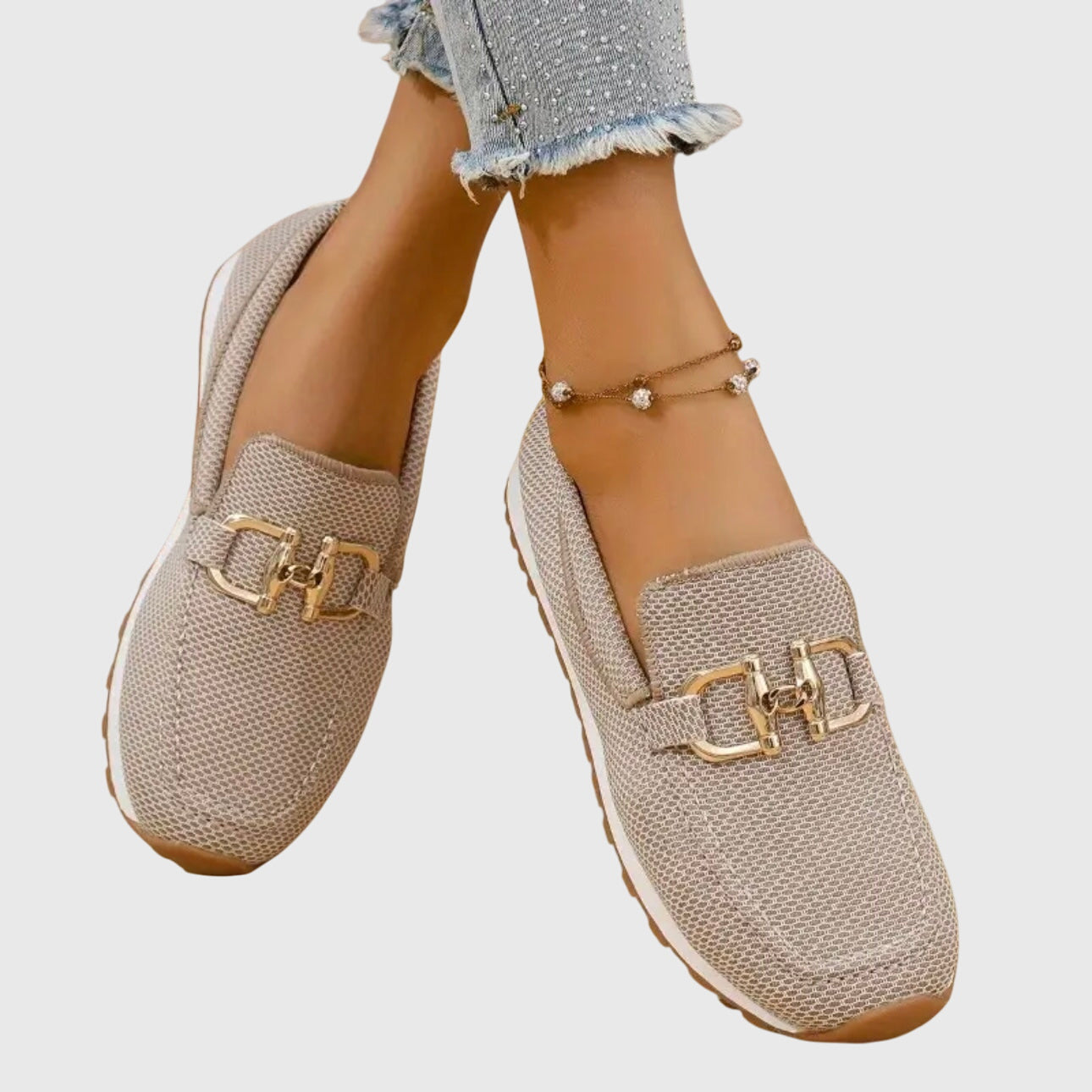Women's slip-on loafer, single shoe photographed against a plain backdrop