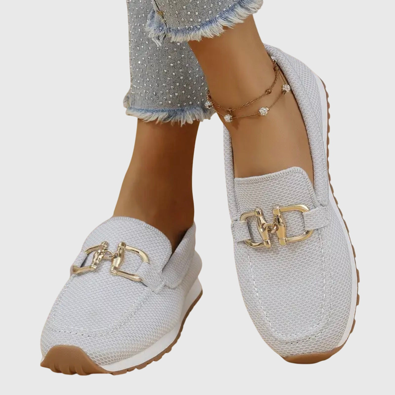 Women's slip-on loafer, profile view showing the last and heel height