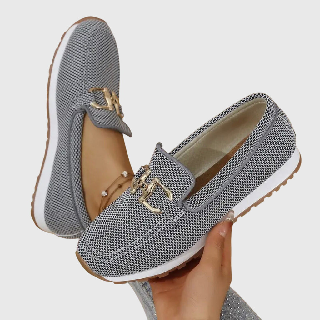 Women's slip-on loafer, viewed from behind at the heel counter