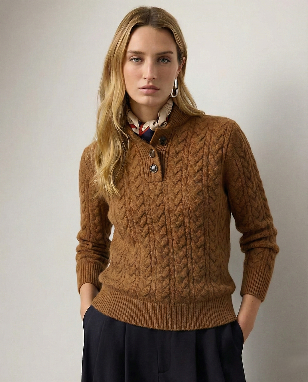 Cable knit cashmere sweater for women, front view with the funnel neck buttoned