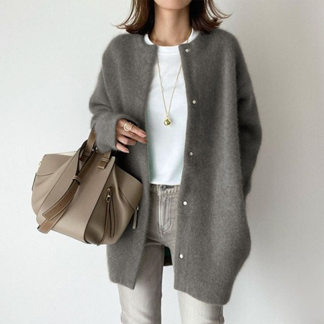 Gray cardigan laid out to show the relaxed waistline