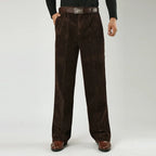 Corduroy pants for men styled with a knit, seated view