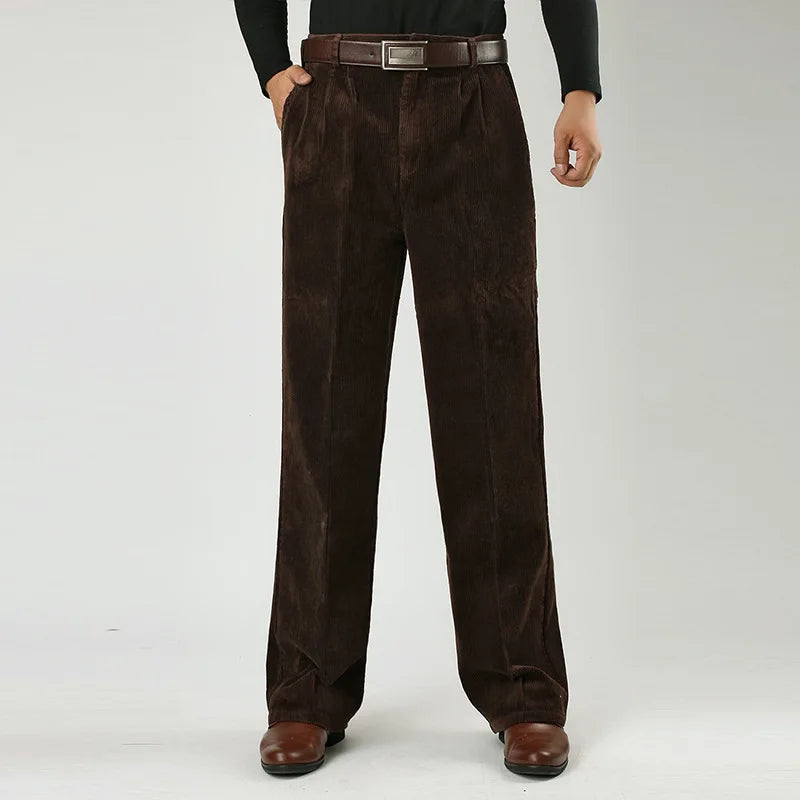 Corduroy pants for men styled with a knit, seated view