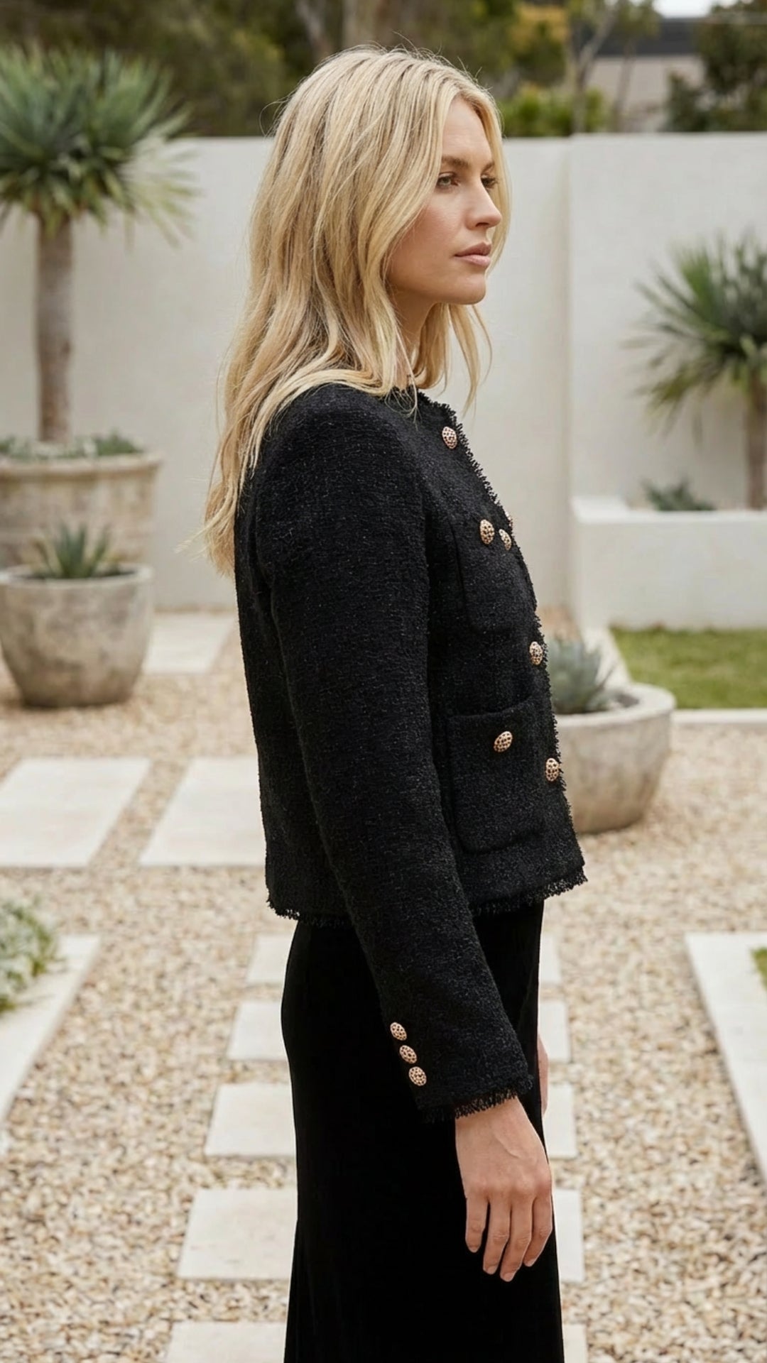 Side profile of the cropped jacket in black
