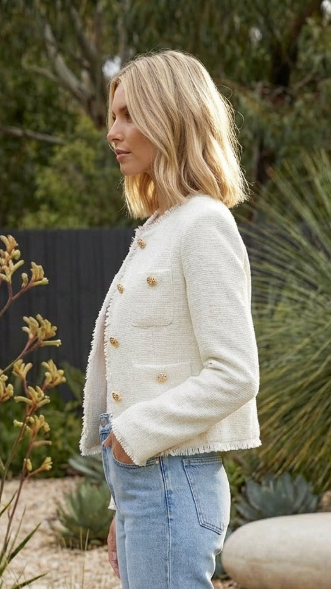 Side profile of the cropped jacket in white