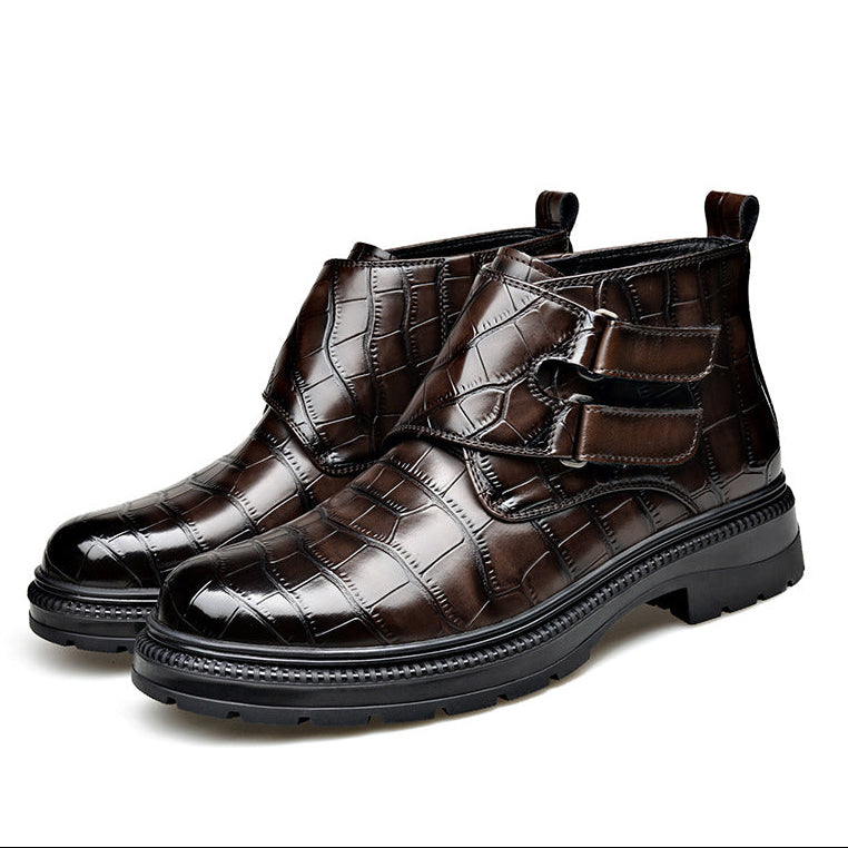 Pair of croc-embossed ankle boots standing together